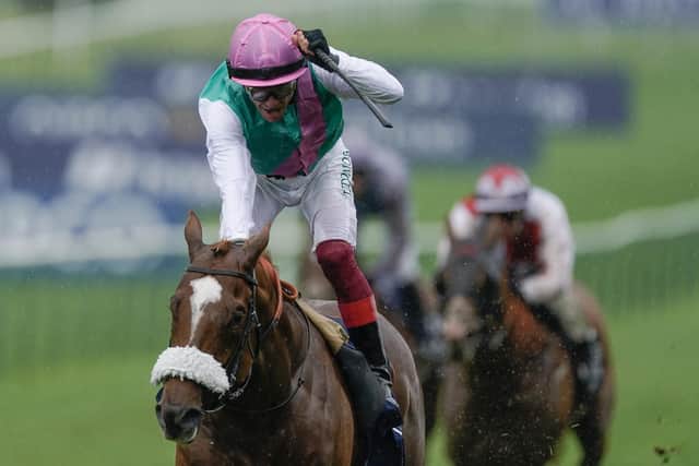 Frankie Dettori riding Chaldean (pink cap) win The Qipco 2000 Guineas Stakes at Newmarket (Photo by Alan Crowhurst/Getty Images)