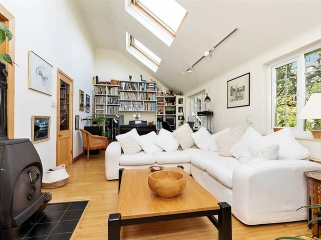 The bright lounge/studio has French doors that open into the garden