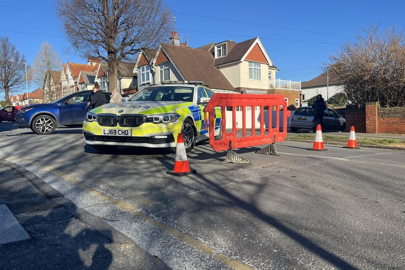 Emergency services are on the scene in Eastbourne following a traffic collision which has caused an oil spill on the road.