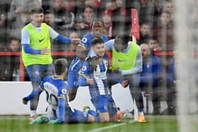 Facundo Buonanotte of Brighton & Hove Albion celebrates with teammates after scoring the team's first goal at Nottingham Forest