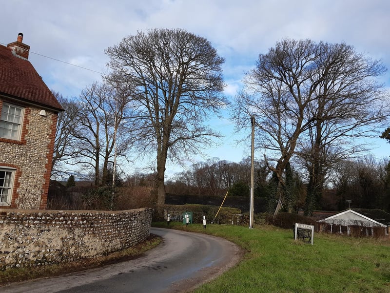 Steep Lane winds round and downhill.