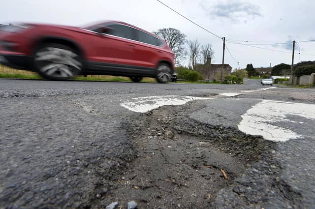 Potholes in Jevington Road, Polegate (Photo by Jon Rigby)