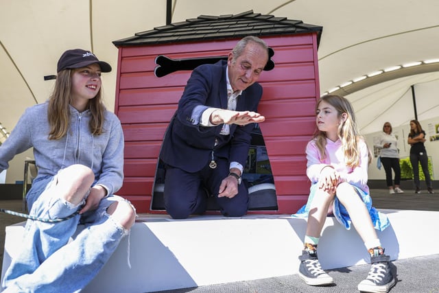 Kevin McCloud meets the Junior Barkitecture winner and tries out her kennel. Photo: Kieran Cleeves, PA