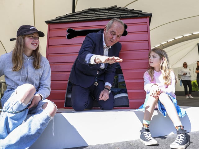 Kevin McCloud meets the Junior Barkitecture winner and tries out her kennel. Photo: Kieran Cleeves, PA
