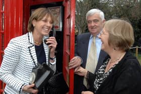 The Duchess of Norfolk on the phone in the sensory garden, sharing a joke with manager Marion Drake and Shaw Healthcare chairman Alun Thomas