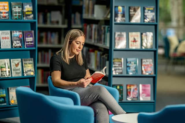 Enjoying reading in a West Sussex Library