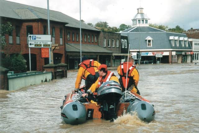 Shoreham lifeboat's Simon Tugwell helming the inshore lifeboat in flooded Uckfield High Street 
