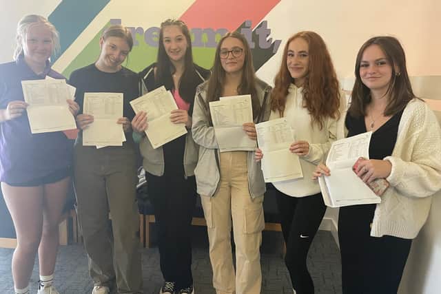 Students at Angmering School celebrate their GCSE results.