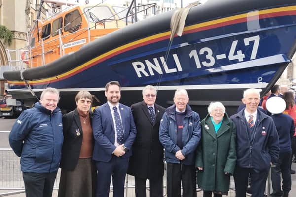 Representatives from Littlehampton Lifeboat Station and fundraising branch attending the Westminster Thanksgiving Service on March 4, 2024. Pictured in front of a lifeboat at Westminster Abbey, left to right, are Anthony Fogg, Gill Partington, Cian Mathews, Nick White, Jim Cosgrove, Lynne Stephens and Ian Flack.