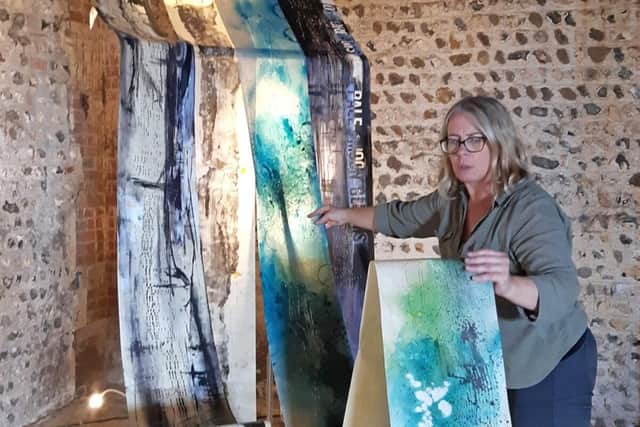 Founder of Salt Edge Arts Emma Taylor with Cuckmere Haven Installation