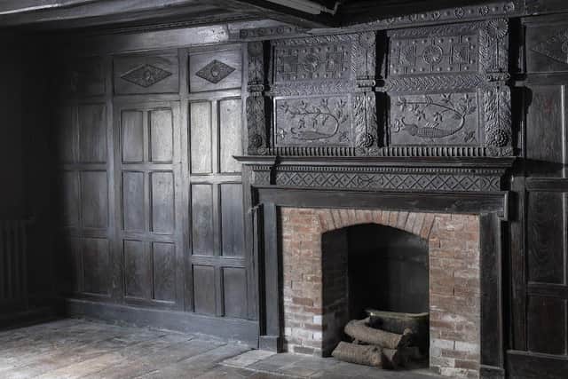 The high-status building is listed due to the high quality of the surviving timberwork including the roof structures, finishes, and the surviving wall paintings, decoration and carved panelling.