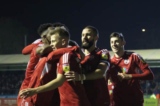 Crawley celebrate scoring against Swindon. Photo: Cory Pickford