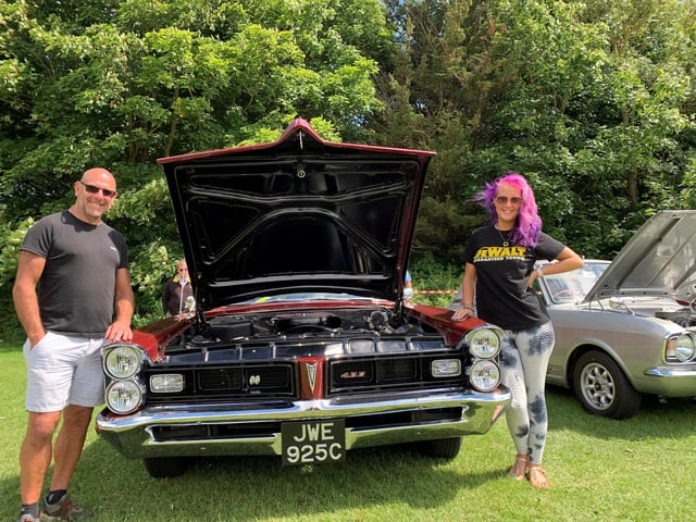Gary Saunders and Leah Saunders with their Pontiac Bonneville