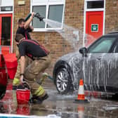Firefighters wash cars for a good cause