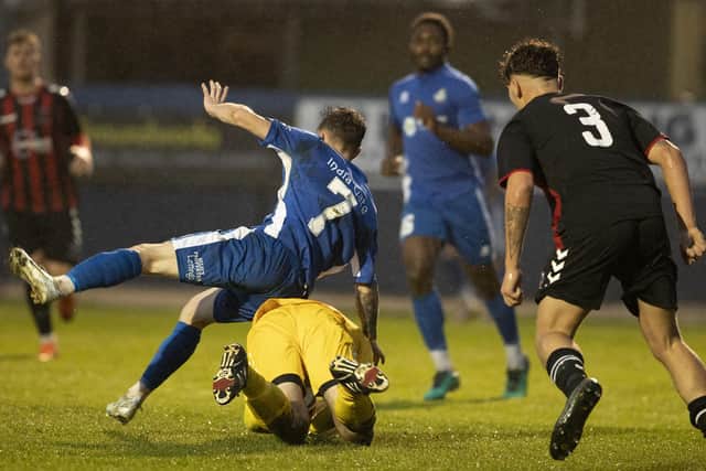 Shane Brazil collides with Oakwood's keeper Andrew Greaves as he makes a save | Picture: Chris Hatton