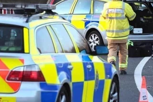 An East Sussex village road is closed after a car crashed during a police chase.