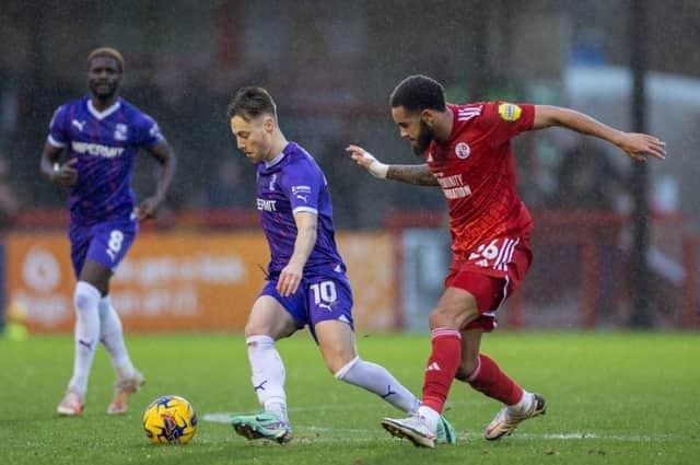 Jay Williams keeps a close on Dan Kemp during Crawley Town's win over Swindon Town on New Year's Day at the Broadfield Stadium. Picture: Eva Gilbert Photography