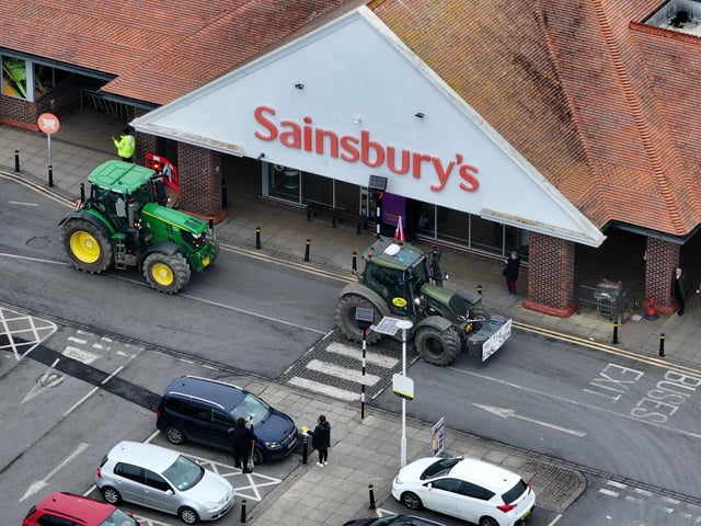 The tractor convoy reaches Sainsburys.