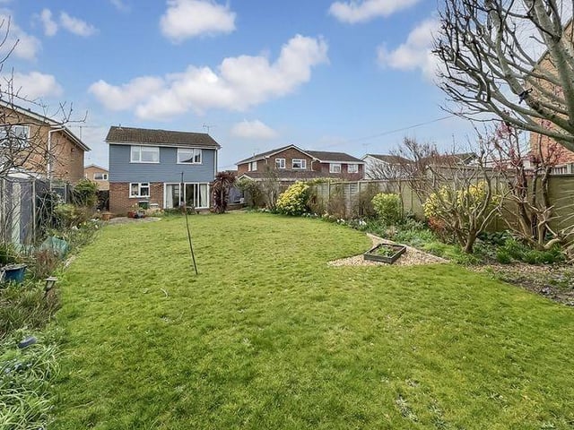 The garden is generous, mainly laid to lawn but with borders and shrubs
