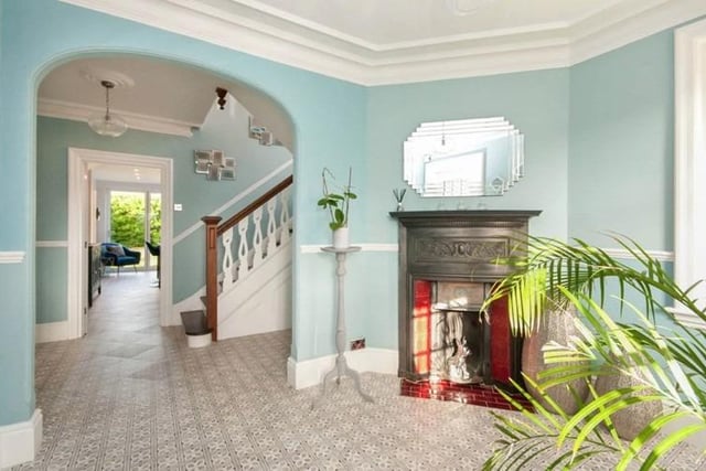 The property consists of a front porch and beautiful period entrance hallway with stairs leading to the second floor. A spacious lounge, large dining room, and a stunning fitted kitchen with island.