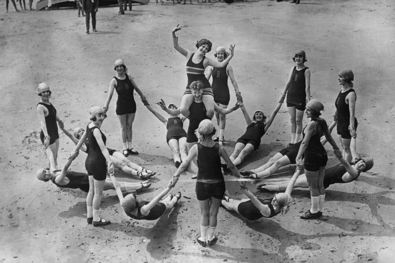 27th June 1922:  American dancer Madge Nerrit (centre) during a dance in her honour by a group of Tiller Girls on the beach at Brighton.