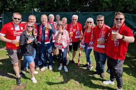 Crawley Town are playing their first ever game at Wembley Stadium. They face Crewe in the League Two play-off final. Here are fans travelling to Wembley and at the Green Man pub ready to watch their Reds heroes.