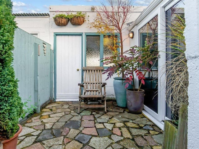 There is a garden office with underfloor heating alongside the spacious garage