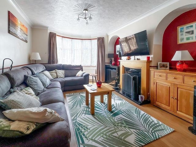 The living room has an attractive bay window