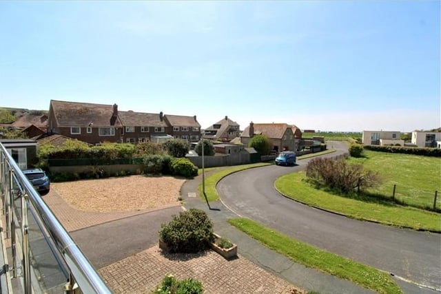 The three bedroom detached house includes a swimming pool and balcony with views to the sea.
