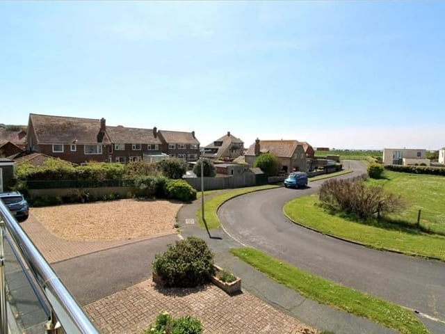 The three bedroom detached house includes a swimming pool and balcony with views to the sea.