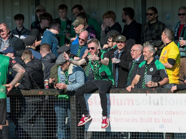 Burgess Hill Town players, fans and staff celebrate surviving in the Isthmian south east division at the end of their 0-0 draw with Beckenham