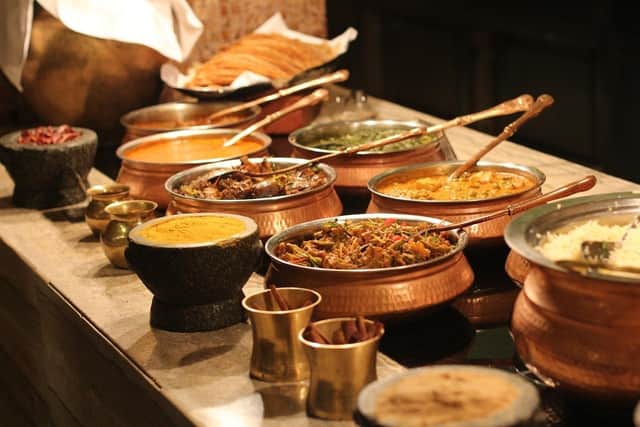 A buffet of Indian food. Image via Pixabay