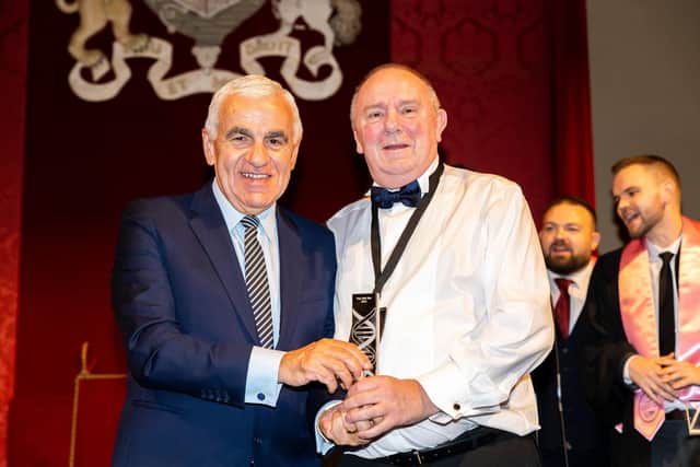 Tony Bond (right) receives his award from Basil Scarsella, chief executive of UK Power Networks.