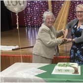 President Pam Lovegrove and Erika Brichta (Chair of West Sussex Federation of WIs) cut the centenary cake. Photo: Rustington WI