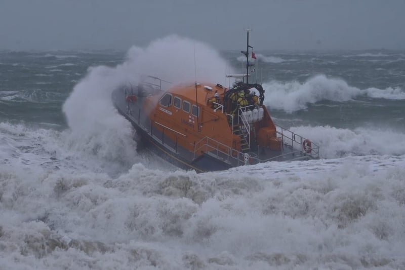 Lifeboats and a helicopter are searching the water near Brighton Pier. Photo: Eddie Mitchell