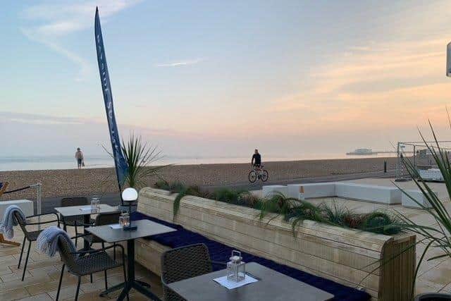 The outside seating area of Bayside Social has a stunning view of Worthing beach