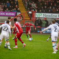 Gallery: Crawley Town and Tranmere share spoils at wet, windy Broadfield