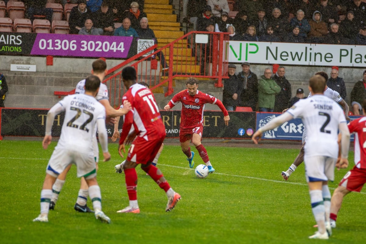 Gallery: Crawley Town and Tranmere share spoils at wet, windy Broadfield