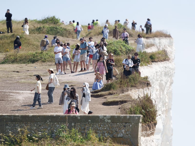 Shocking photos show sunbaskers standing near edge of cliffs at Birling Gap