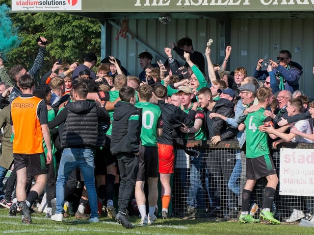 Burgess Hill Town players, fans and staff celebrate surviving in the Isthmian south east division at the end of their 0-0 draw with Beckenham