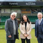 Simon Cook, Freya and Dominic Reynolds in front of the newly sponsored stand | Pic: Lyn Phillips/Trev Staff