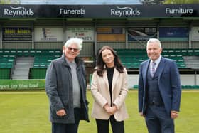 Simon Cook, Freya and Dominic Reynolds in front of the newly sponsored stand | Pic: Lyn Phillips/Trev Staff