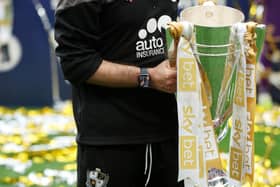Darrell Clarke, Manager of Port Vale celebrates with the Sky Bet League Two Trophy (Photo by Eddie Keogh/Getty Images)