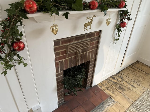 Clearing space for the new shop has revealed even more of the shop's once-hidden character - like this beautiful feature fireplace.