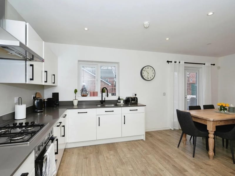 The kitchen/dining room has an adjoining utility room
