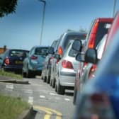 A rolled over car has closed a road outside Crawley