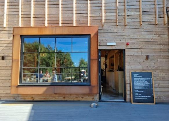Set in a sustainable business park in 46 acres of woodland, this bistro features communal tables and a lovely terrace overlooking the trees