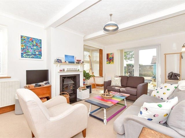 The living room boasts a wood burner, ideal for those chilly nights