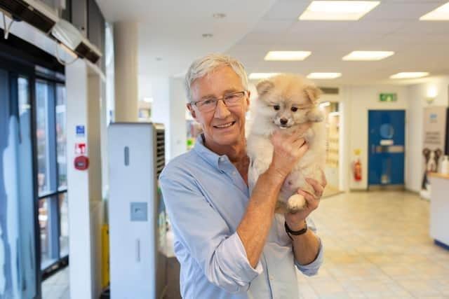 Paul O’Grady fans and their dogs have lined the streets for the TV star’s funeral today (Thursday, April 20).