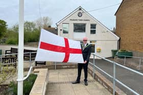 Mayor of Polegate Cllr Dan Dunbar raising the St George flag.